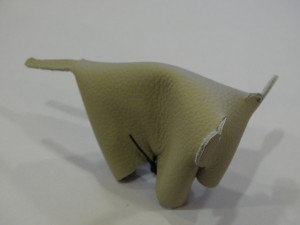 Leather sample shaped formed into a cow